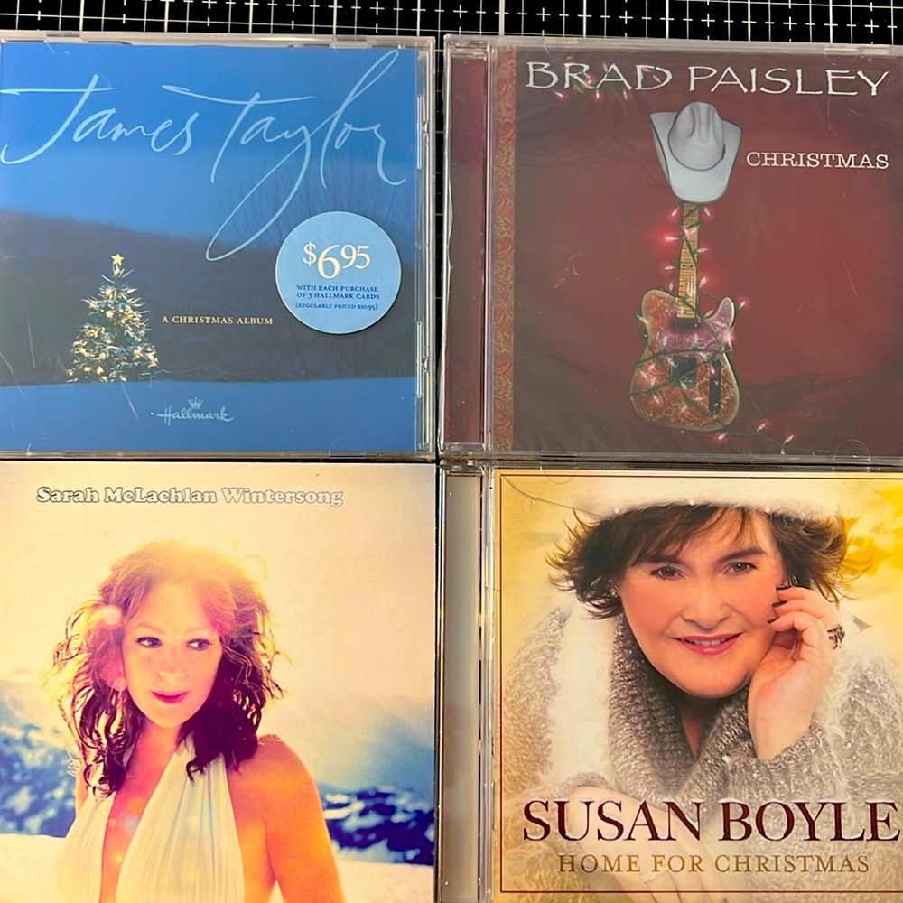 4 Christmas CDs. James Taylor, Brad Paisley, Sarah McLachlan & Susan Boyle